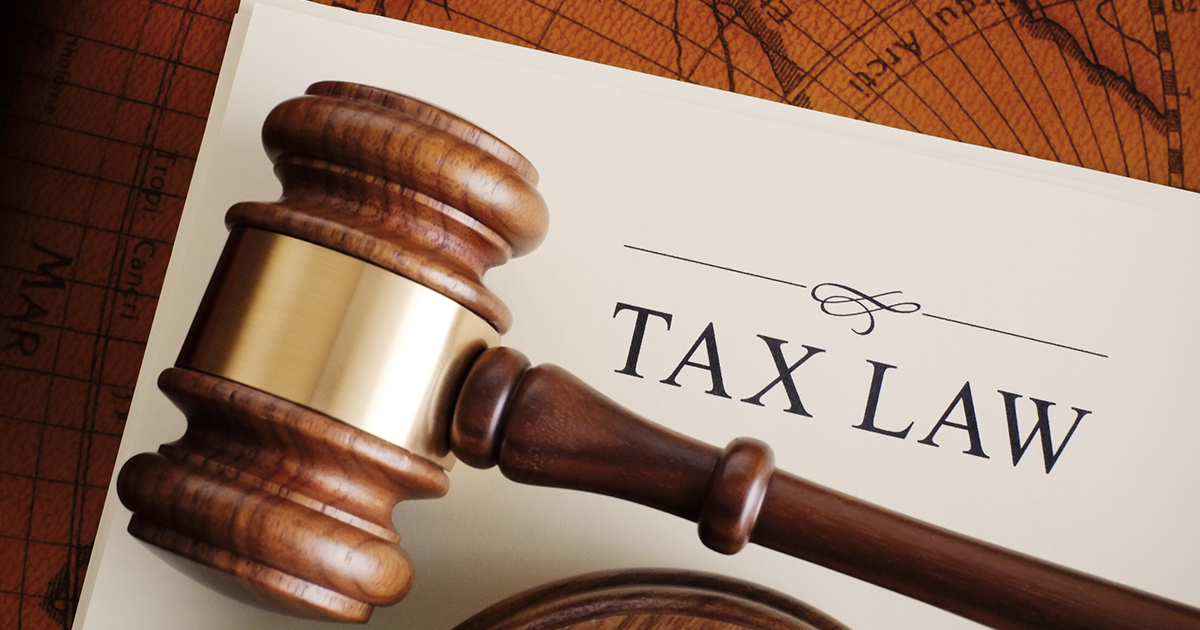 Brown gavel on a white tax law document